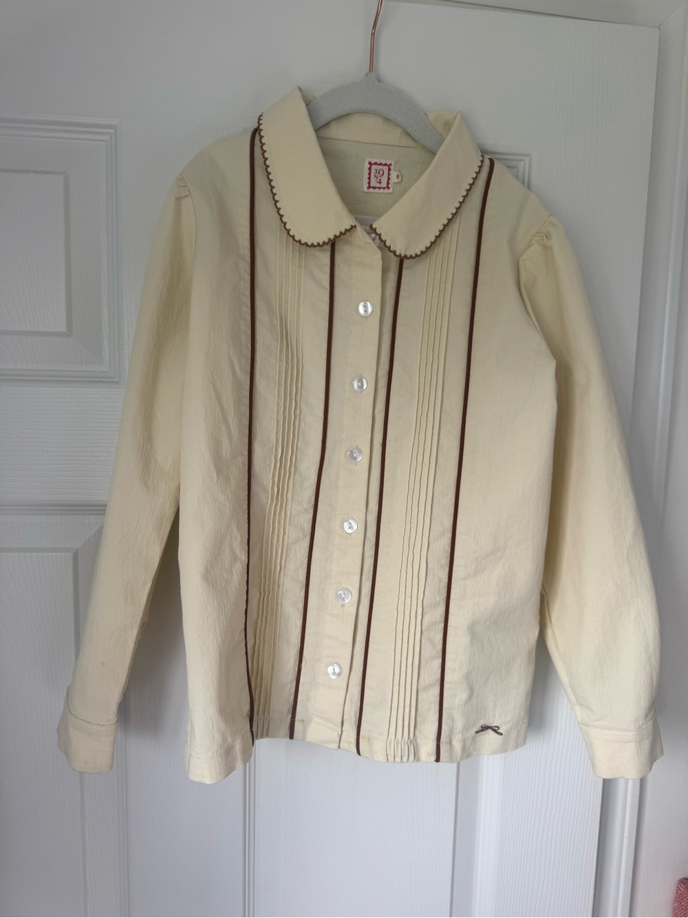Cream Girls' Button-Front Jacket w/ Brown Trim- pair with brown jumper in closet
